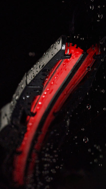 Close up of Kimblade rear wiper featuring rectangular red silicone blade with water droplets highlighting durability and wet performance